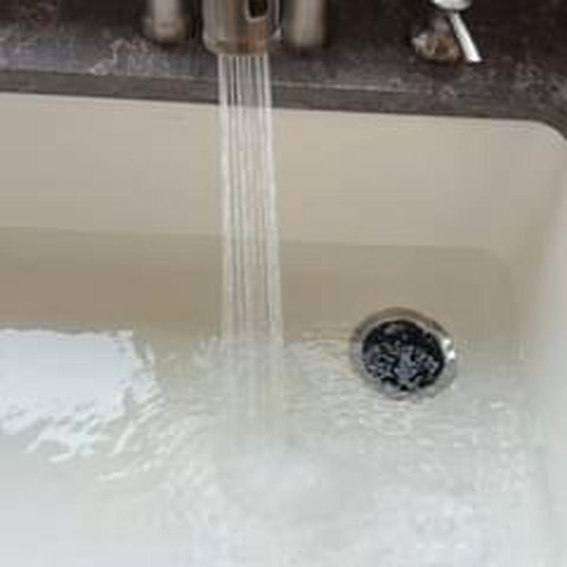 Kitchen sink drain with running water flow