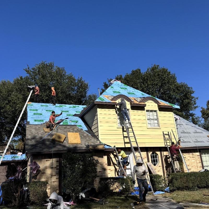 Residential roof decking replacement with weather barrier installation