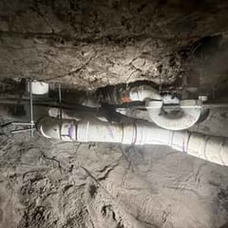 Cast iron drainage system with PVC replacement in crawlspace