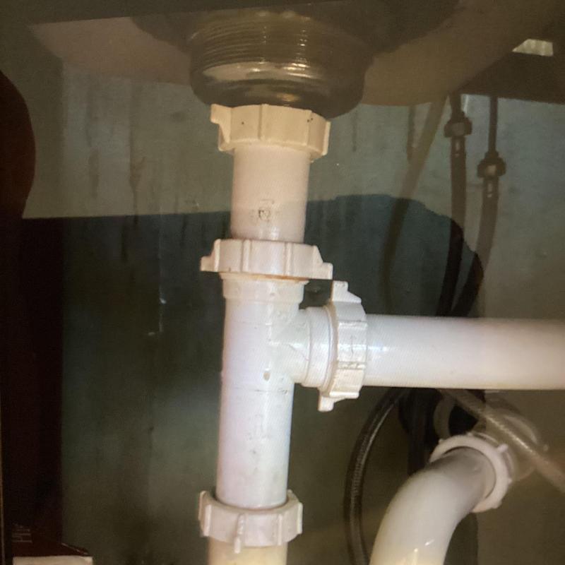 Kitchen sink tailpiece and drain pipes under sink