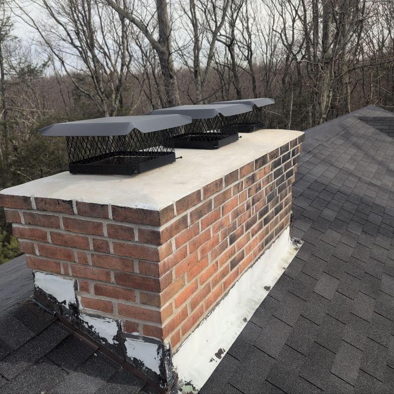Chimney caps and brick repointing on roof Chimney caps and brick repointing on roof