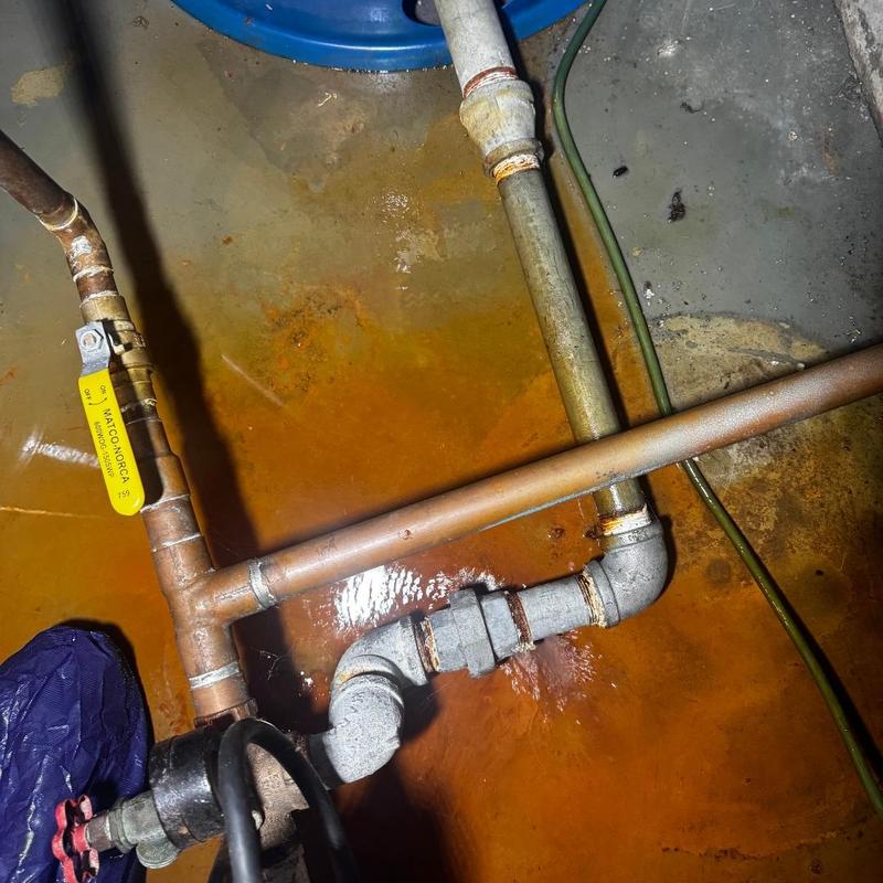 Galvanized pipe leak with copper replacement near tank