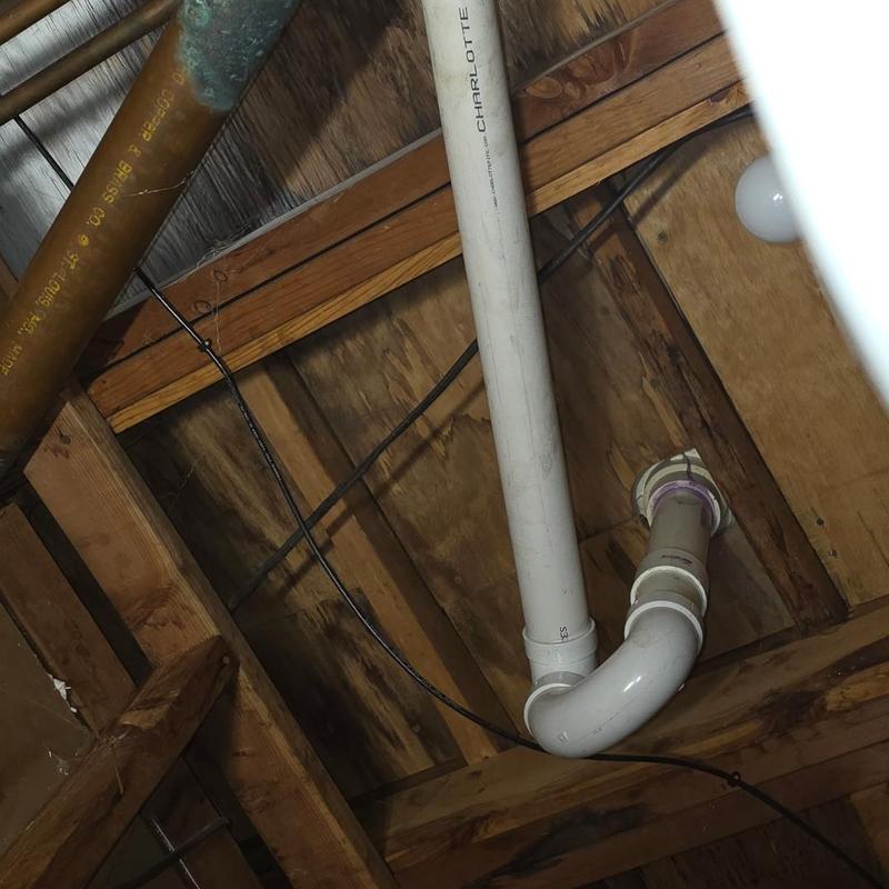 4-inch PVC sewer pipe with elbow joint installed