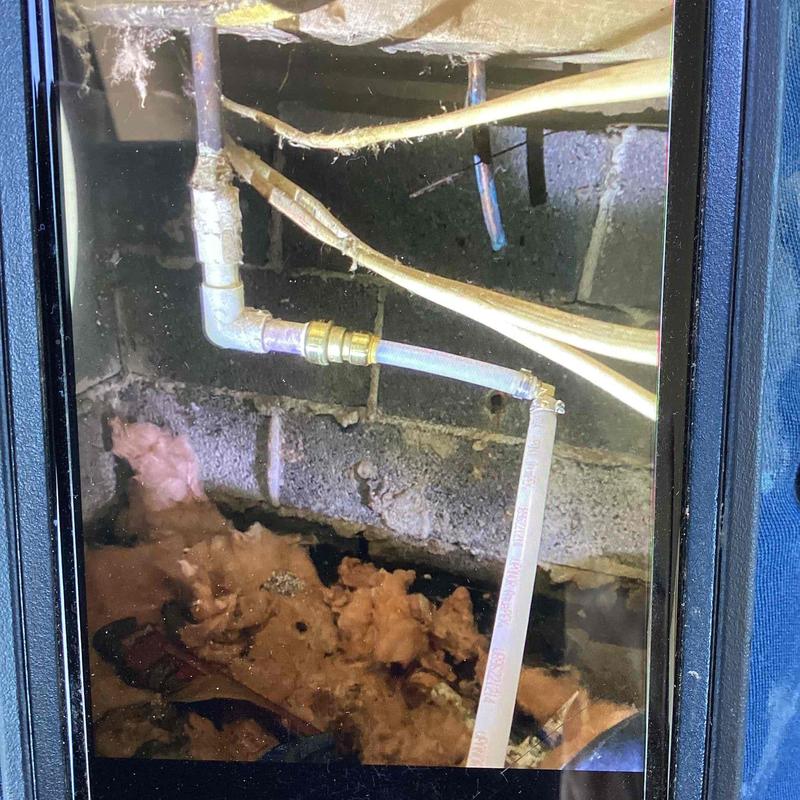 PEX water pipes with new fittings in crawl space