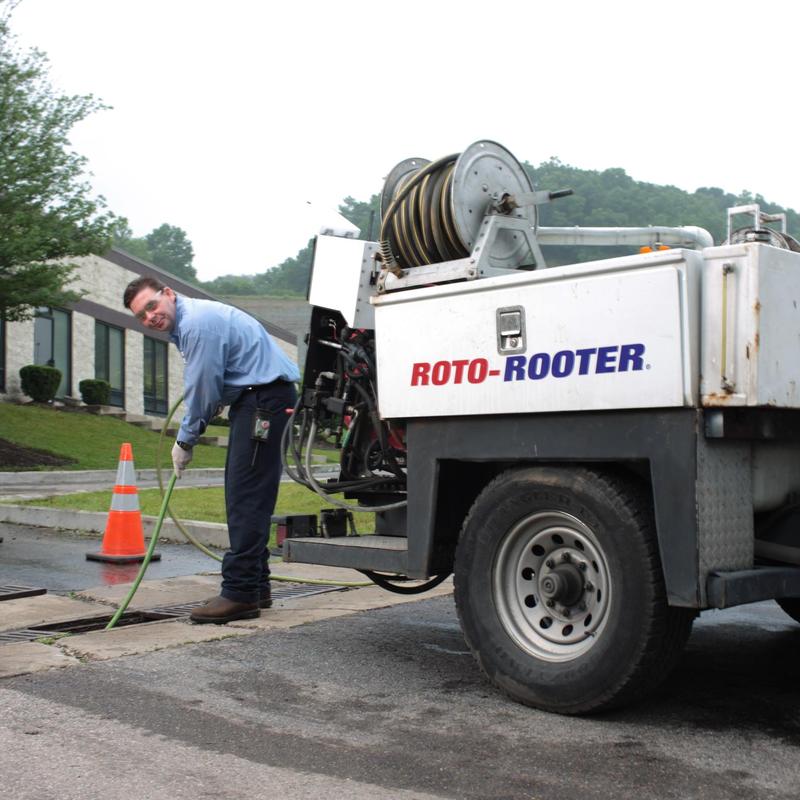 Sewer line jetting with Roto-Rooter truck and technician