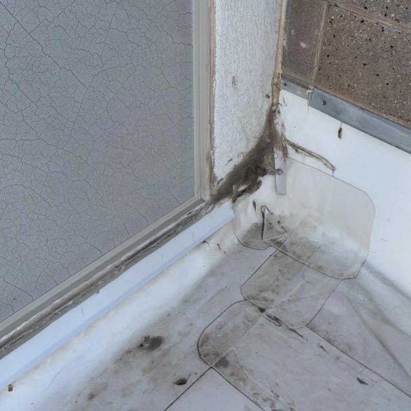 TPO commercial roof corner with dirt and damage