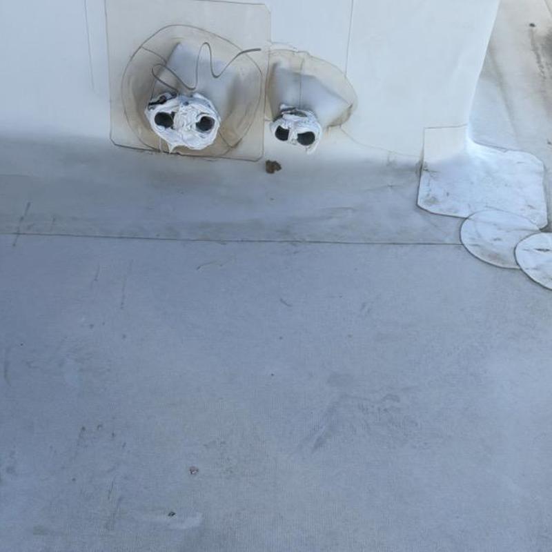 TPO roof penetrations with sealed flashing patches