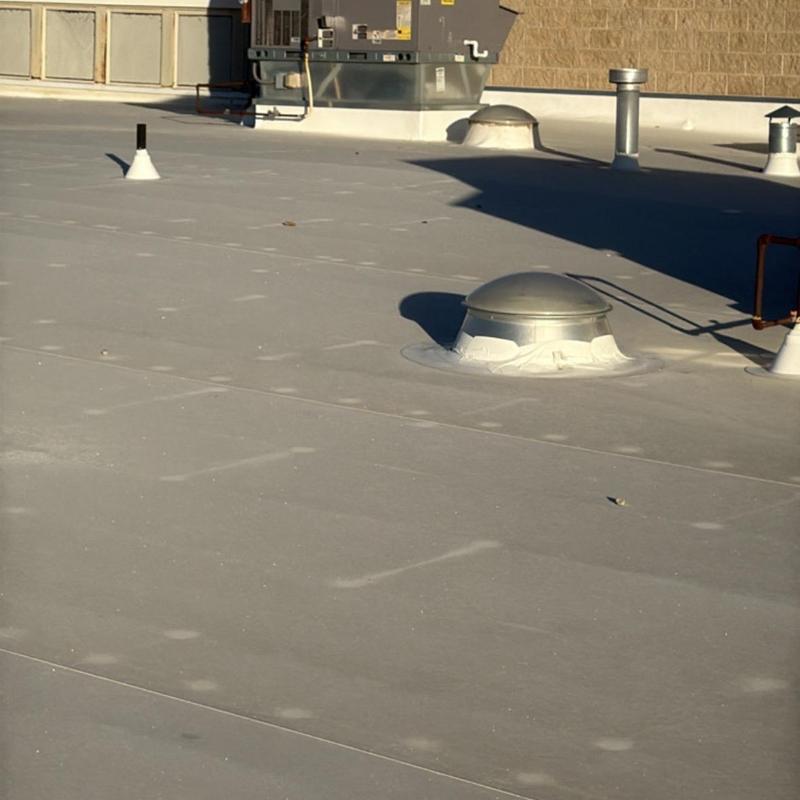 TPO commercial roof with HVAC units and vents