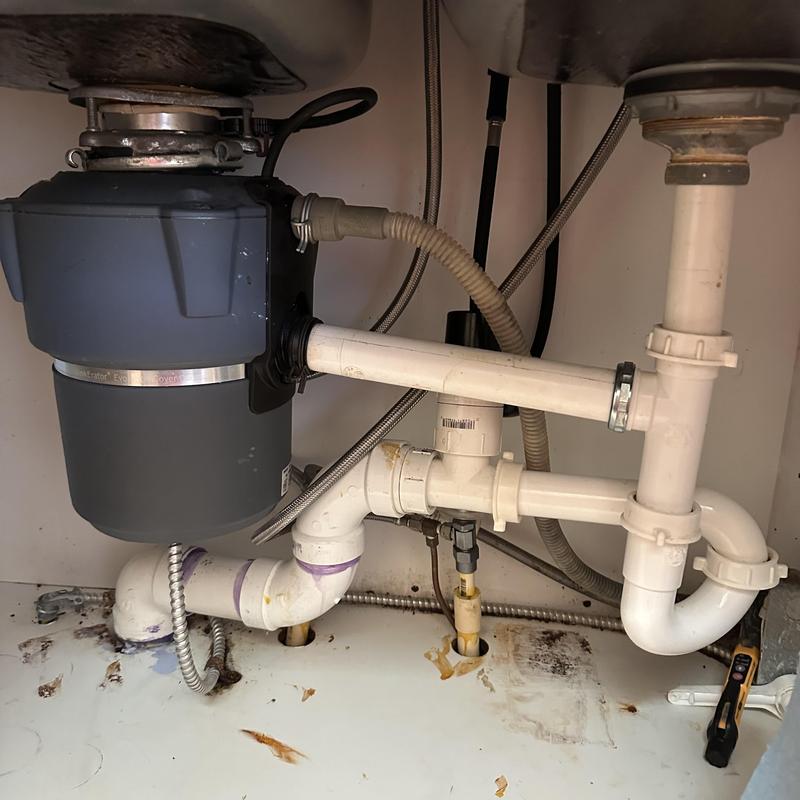 Kitchen sink disposal and drain plumbing installation
