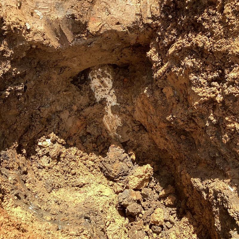 4-inch PVC septic line buried in excavated soil