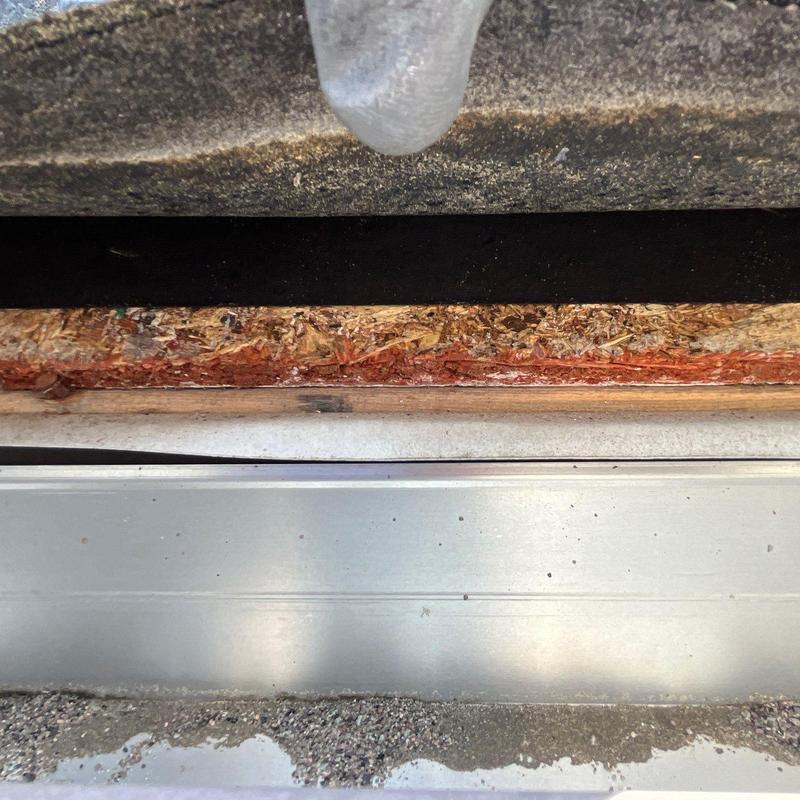 Roof sheathing with water damage under shingles