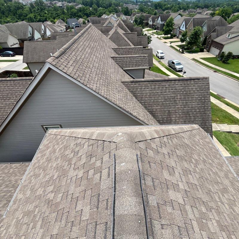 Asphalt shingle roof showing hail damage and granule loss