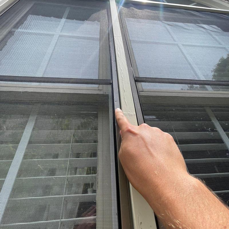 Window screen frame with gap being pointed at