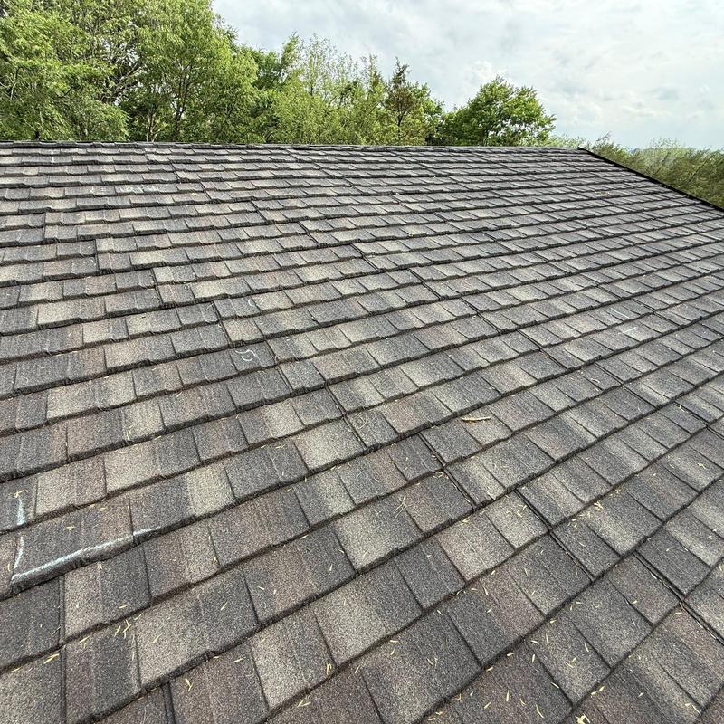 Asphalt shingle roof with hail damage and chalk markings