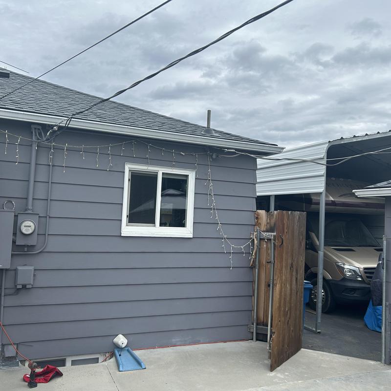 Split bus electrical panel on house exterior wall Split bus electrical panel on house exterior wall