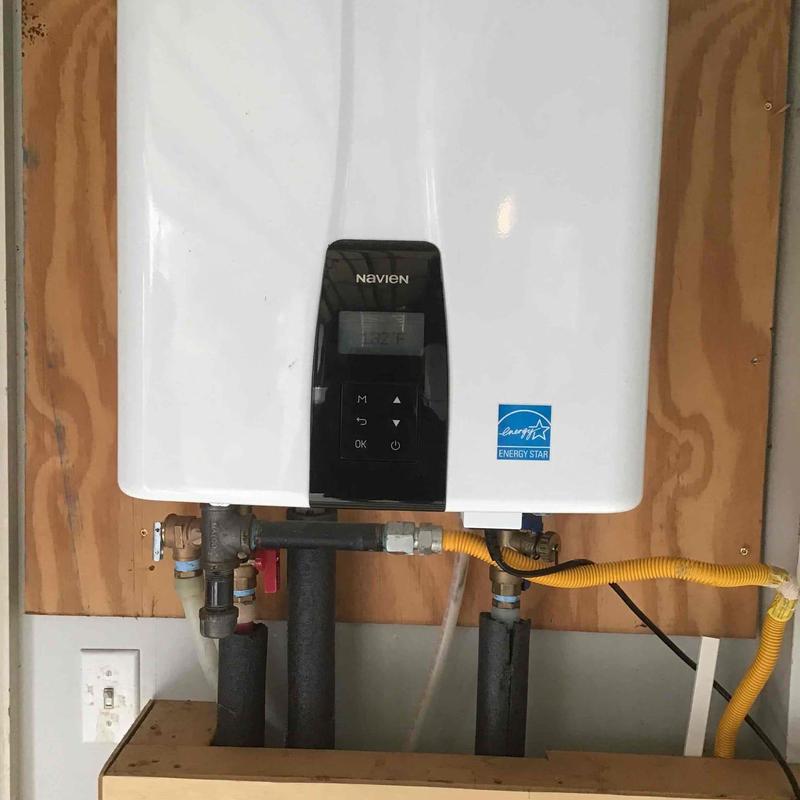 Tankless water heater with piping and controls