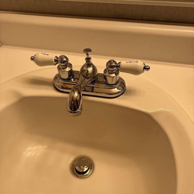 Bathroom sink faucet with pop-up drain assembly