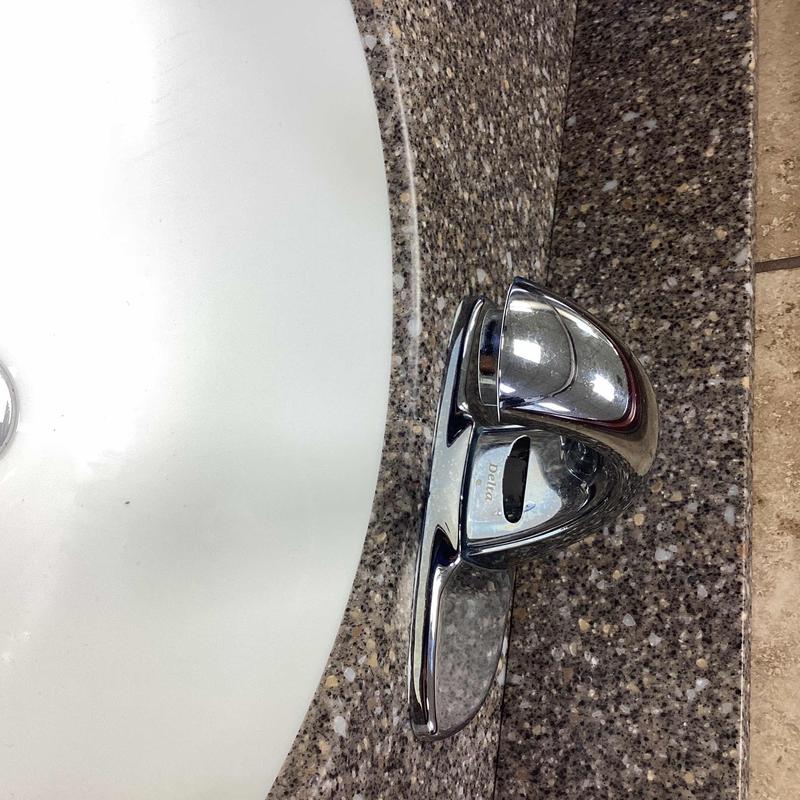 Faucet sensor and handle on bathroom sink