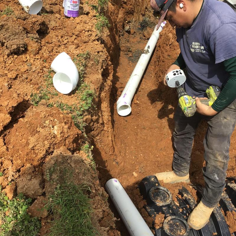 PVC field lines installation with plumbing tools
