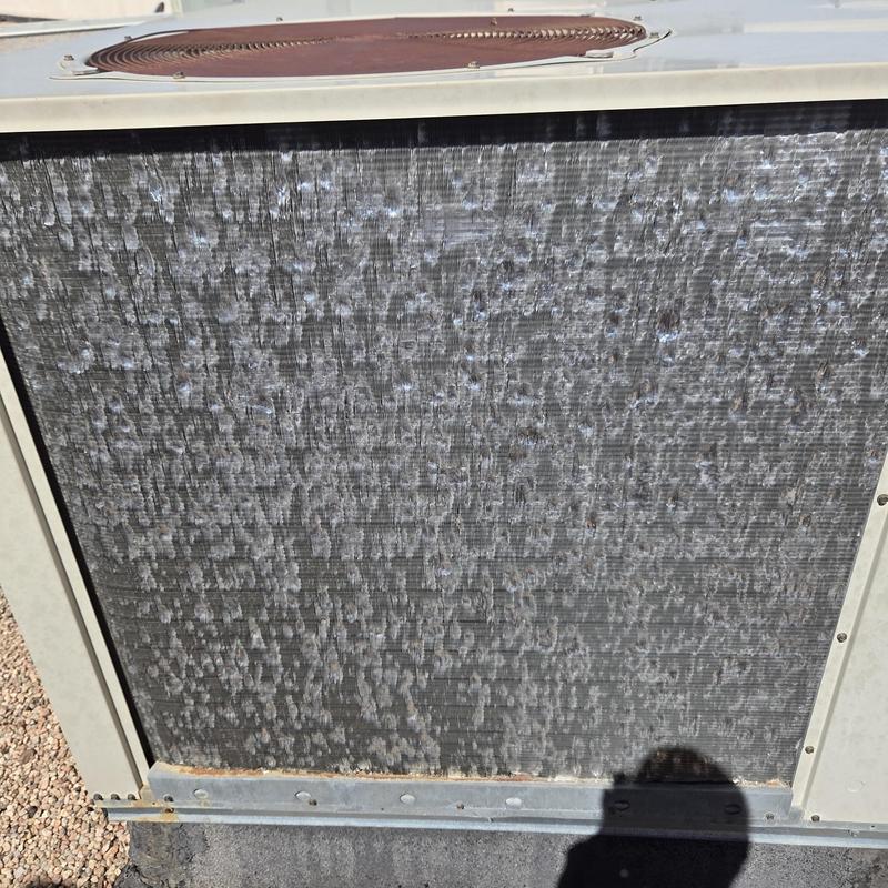 Rooftop AC unit condenser coil with surface residue