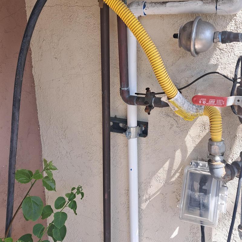 Tankless water heater gas line with valve and piping