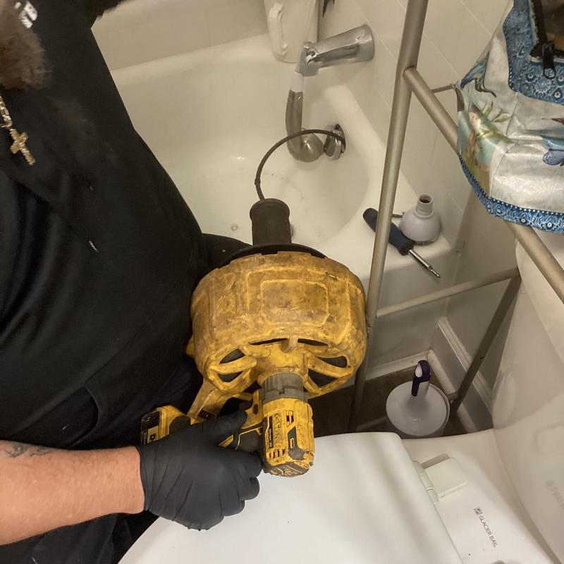 Bathtub drain with plumbing auger clog removal