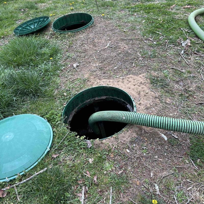 Septic tank with suction hose for pumping service