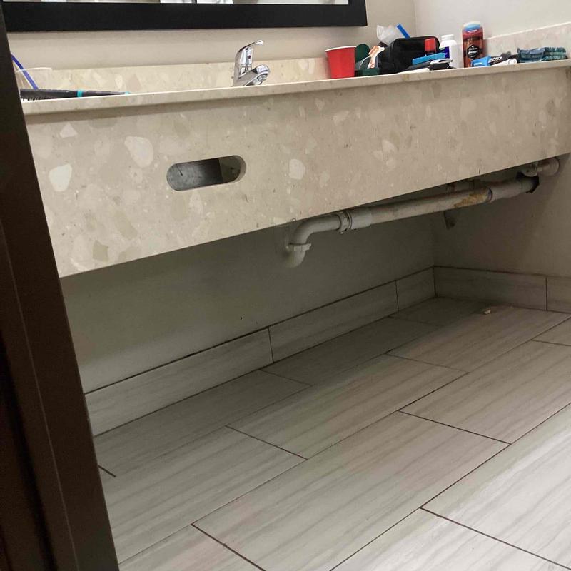 Bathroom sink drain pipe installation under countertop