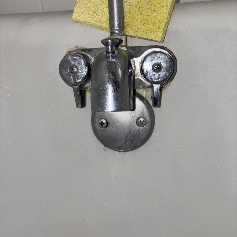 Shower faucet hot-side handle adjustment in tub