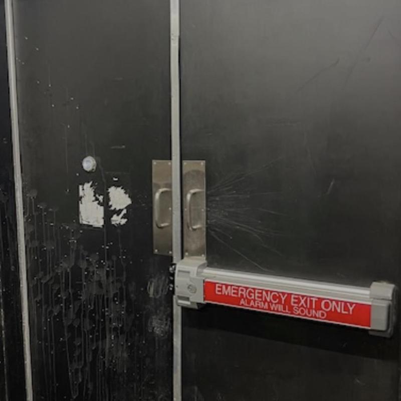 Detex automatic locking device on double doors