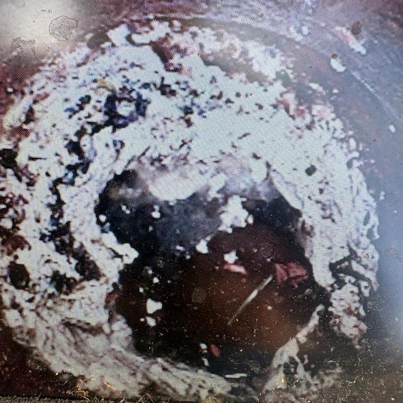 House trap clogged with grease buildup interior view