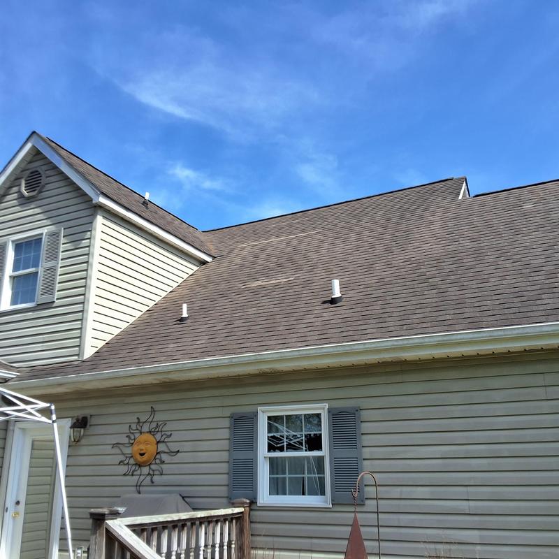 Asphalt shingle roof over 20 years old with vents