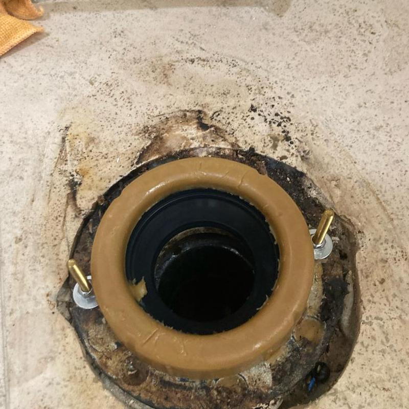 Toilet flange with new wax ring installed on floor Toilet flange with new wax ring installed on floor