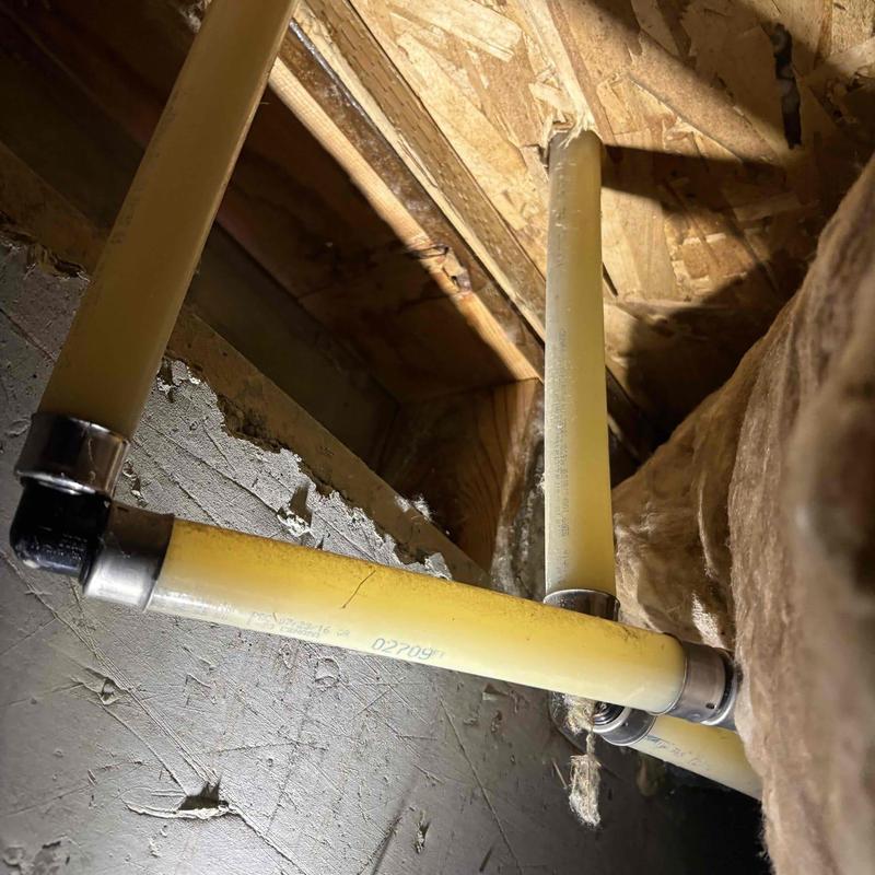 Pex hot water supply line in wall with fittings