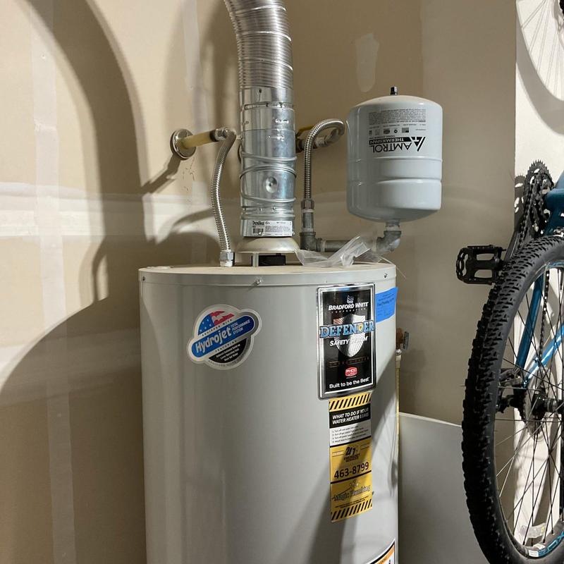 Gas control valve on water heater with vent pipe Gas control valve on water heater with vent pipe