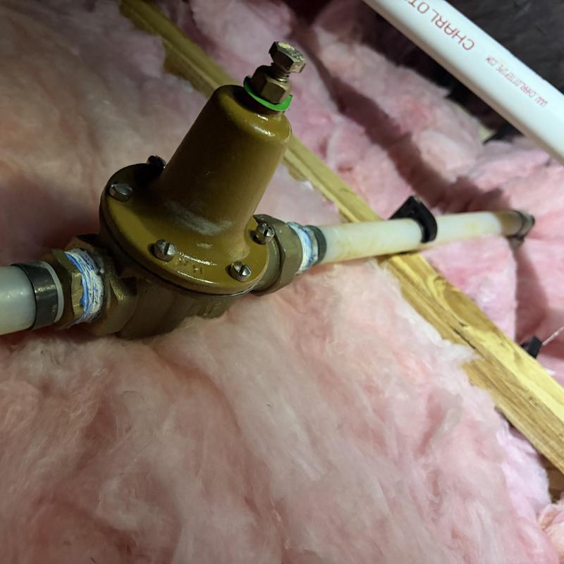 Pressure reducing valve with piping in attic insulation Pressure reducing valve with piping in attic insulation