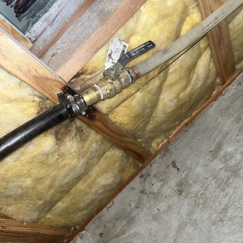 Main water line valve and service connection in crawlspace
