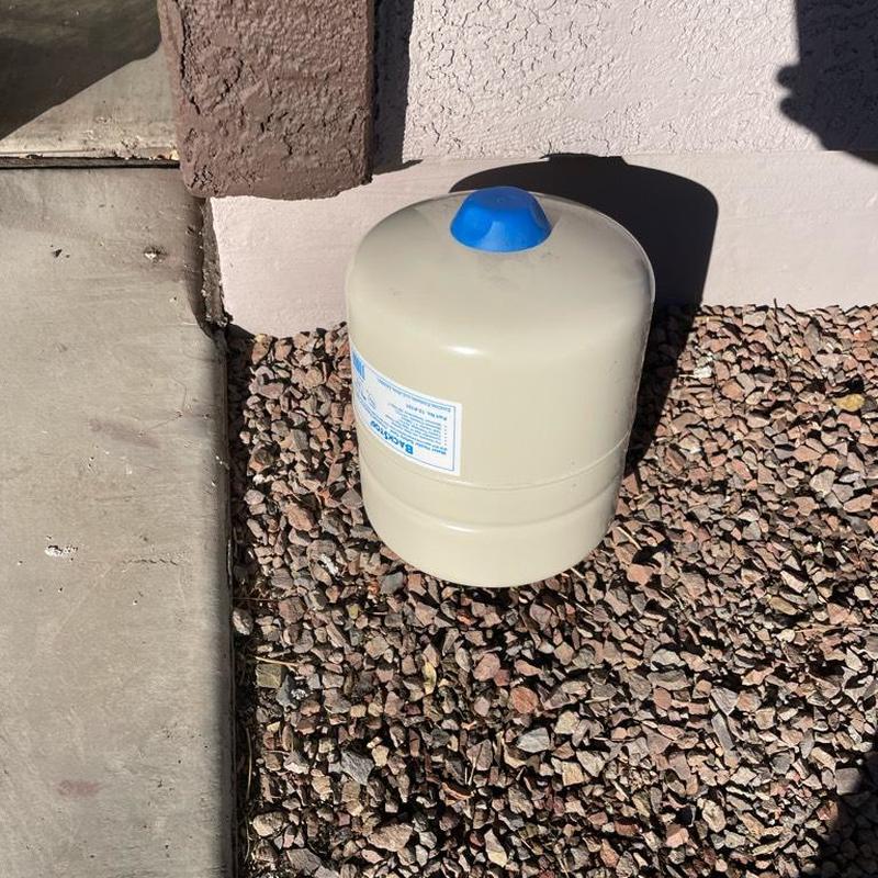 Water heater expansion tank installed on gravel ground