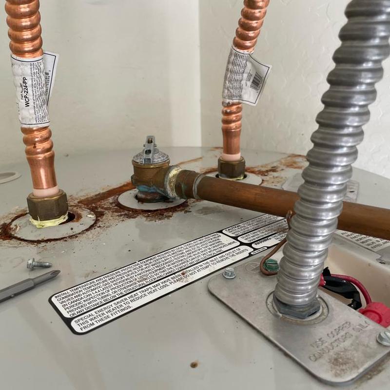 Water heater tank with new copper piping connections