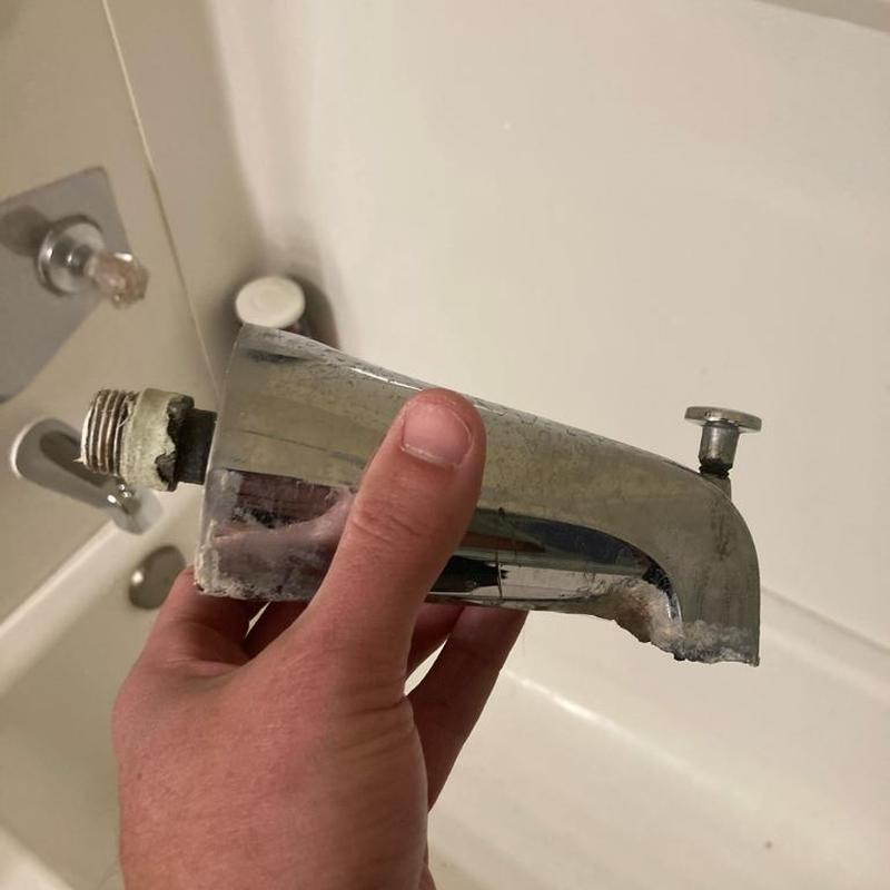 Tub spout replacement removed for repair in bathroom Tub spout replacement removed for repair in bathroom