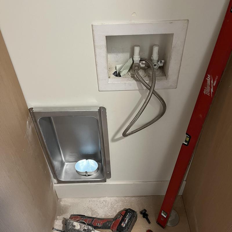 Dryer vent installation with water supply lines and tools Dryer vent installation with water supply lines and tools