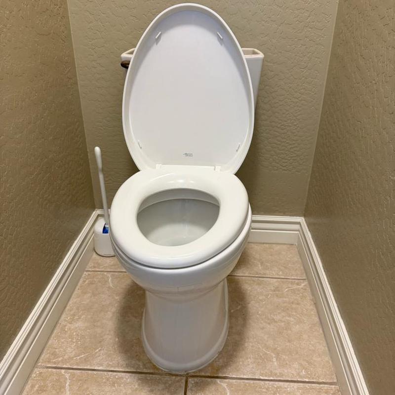 Toilet with new wax ring and silicone seal installed Toilet with new wax ring and silicone seal installed