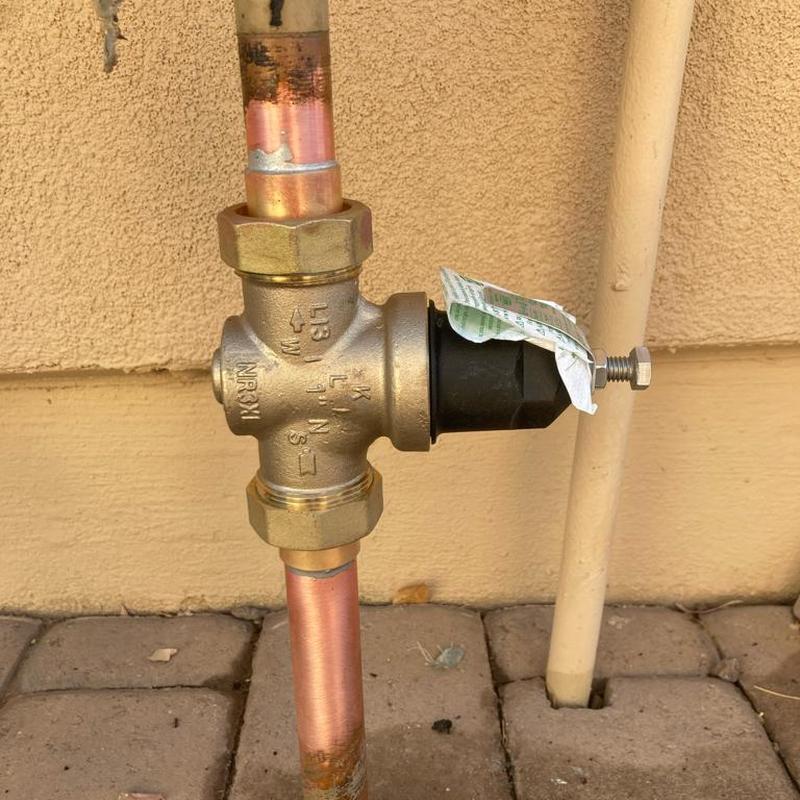 Pressure reducing valve on copper water line outdoors