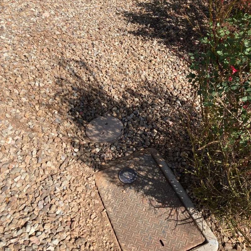 Pressure reducing valve meter box with gravel and bush