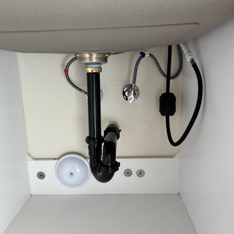 Laundry sink drain pipe and water line connections installation