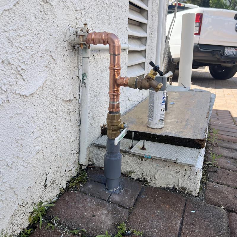 Copper water main shutoff valve installation outdoors