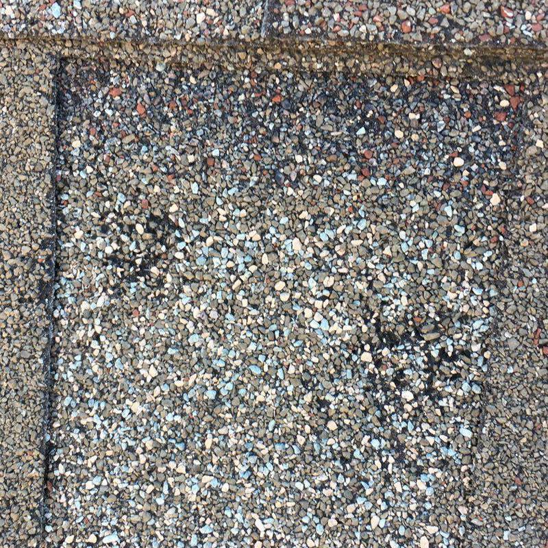 GAF Timberline shingle roof close-up showing hail damage GAF Timberline shingle roof close-up showing hail damage