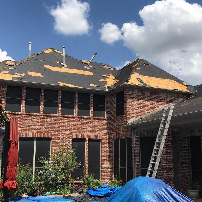 Roof decking with removed shingles during replacement Roof decking with removed shingles during replacement