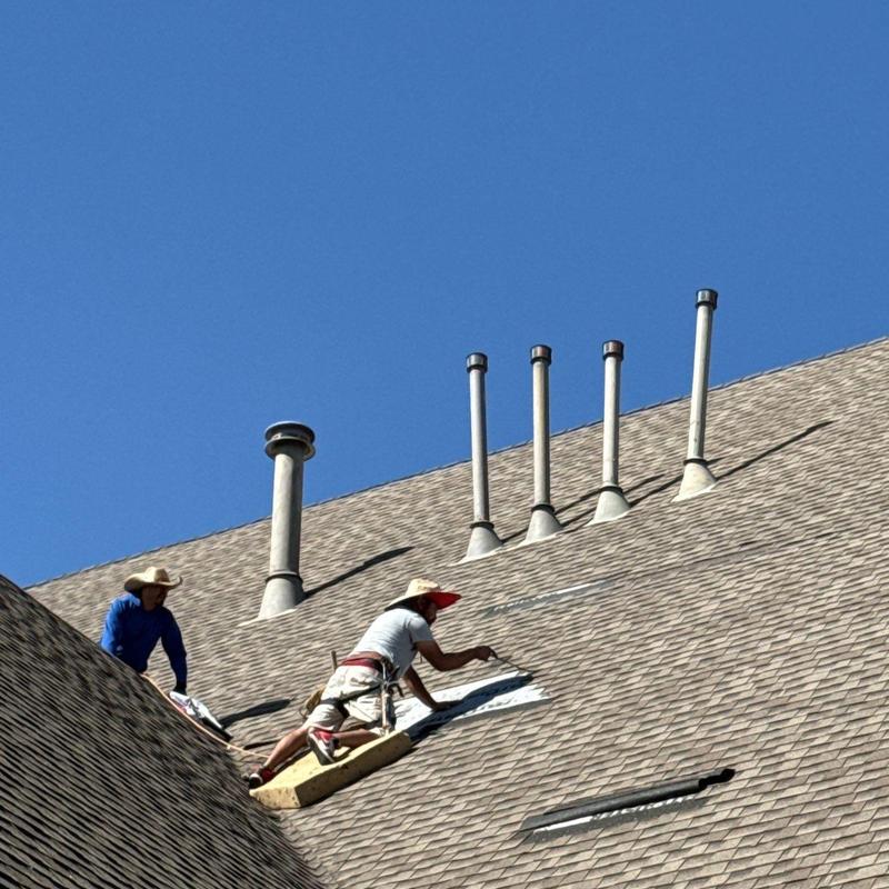 Roof shingles repair on steep church roof in McKinney