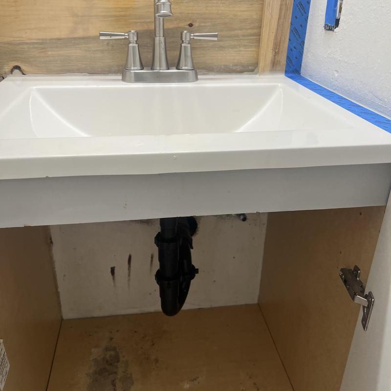 Lavatory faucet and pop-up drain installation in cabinet Lavatory faucet and pop-up drain installation in cabinet